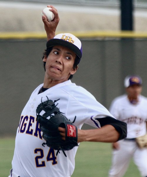 Lemoore's Champ Kaiser pitches in the first inning against Exeter.
